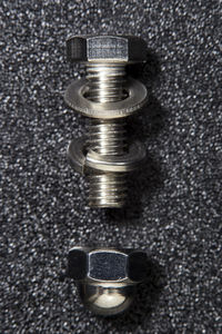High angle view of coins on black background