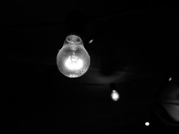 Low angle view of illuminated light bulb