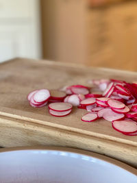 Close-up of pink roses on table