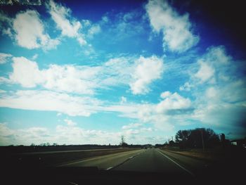 View of road against cloudy sky