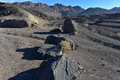 Shadow of people on desert against sky