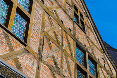 Low angle view of building against clear blue sky