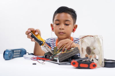 Boy playing with toy car