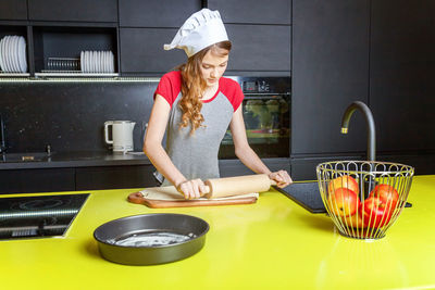 Side view of man preparing food at home