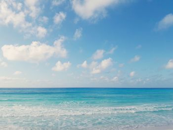 Scenic view of sea against cloudy sky