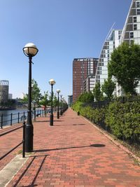 Street amidst buildings against sky