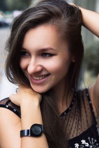 Close-up portrait of a smiling young woman