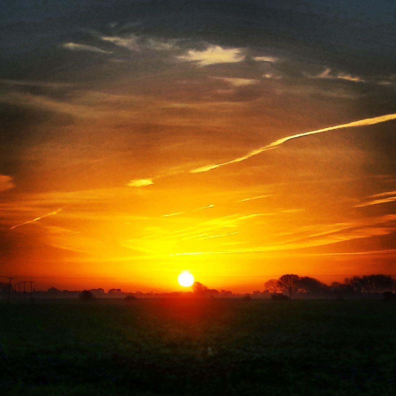 sunset, sun, scenics, tranquil scene, landscape, beauty in nature, orange color, tranquility, sky, idyllic, nature, silhouette, field, sunlight, sunbeam, cloud - sky, dramatic sky, cloud, horizon over land, outdoors