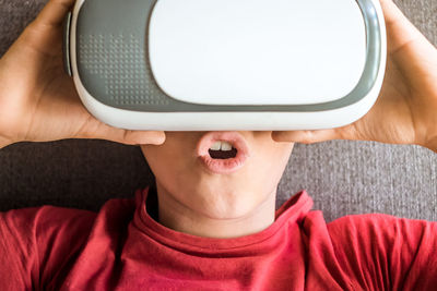 Close-up of boy using virtual reality simulator