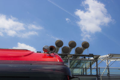 Red car against sky