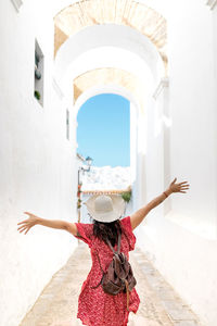 Woman standing in front of building