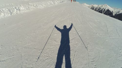 Shadow of man on snow