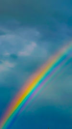 Low angle view of rainbow in sky