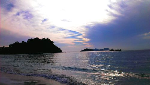 Scenic view of sea against cloudy sky