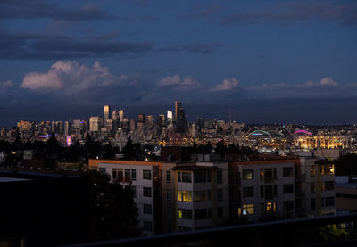 High angle view of illuminated buildings in city