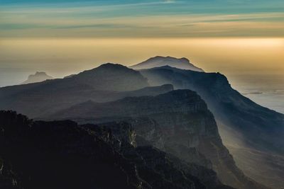 Scenic view of mountains against sky during sunset
