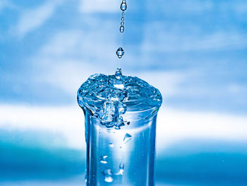 Close-up of drop splashing water