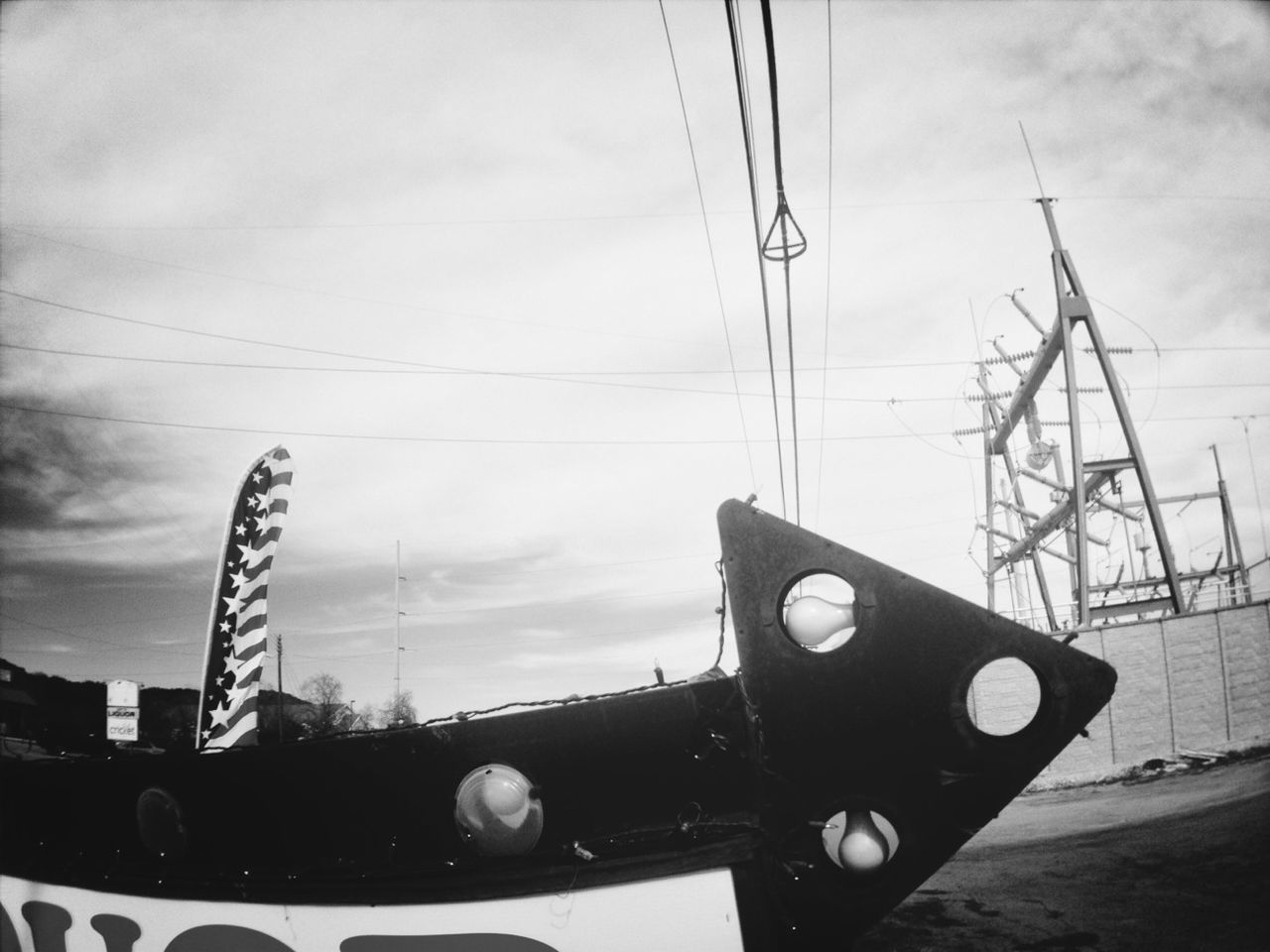 sky, electricity pylon, power supply, power line, fuel and power generation, technology, transportation, cloud - sky, electricity, cable, built structure, mode of transport, building exterior, cloud, no people, low angle view, connection, land vehicle, outdoors, architecture