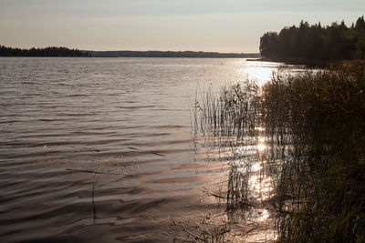 Scenic view of lake against sky during sunset