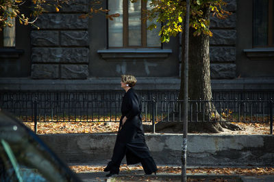 Rear view of woman walking outdoors