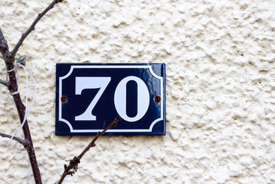 House number 70 on a white wall in london 