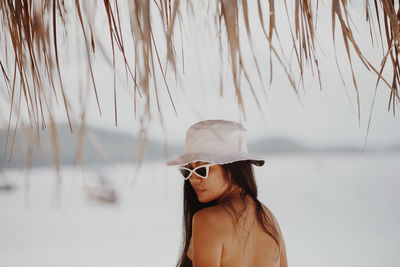 Woman wearing sunglasses at beach