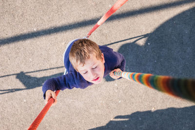 High angle view of boy playing on playground