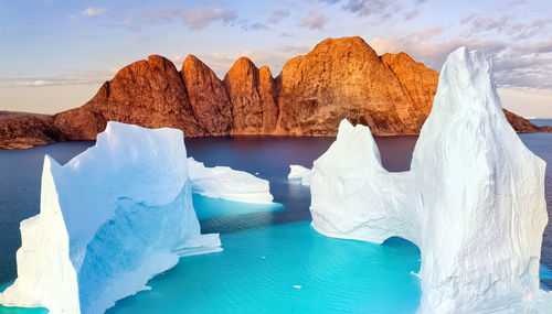 Iceberg floating in greenland fjord.