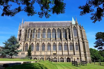 Low angle view of historical building against blue sky