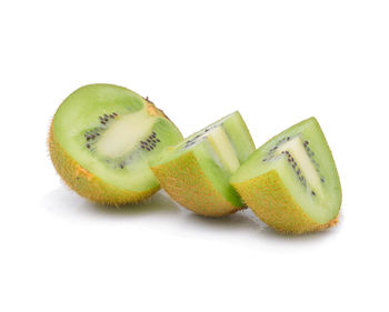 Close-up of kiwi slices on white background