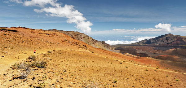 Wide volcanic landscape in different colors, wide view, ocher shades, trail, hawaii, maui, haleakala