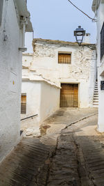 Alley amidst buildings in city