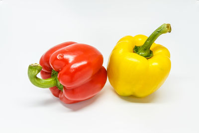 Close-up of bell peppers against white background