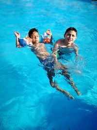 Boys swimming in pool