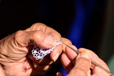 Close-up of senior hands holding knitting needle