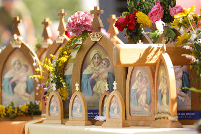 Close-up of virgin mary and jesus picture frames