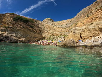Scenic view of the sea surrounded by the rocks. 100 stairs beach santa cesarea terme apulia italia 