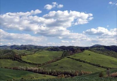 Scenic view of landscape against cloudy sky