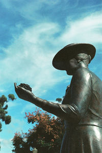 Low angle view of statue against sky