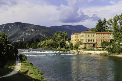 Scenic view of lake and mountains against sky in bassano del grappa