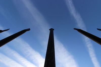 Low angle view of tower against blue sky