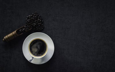 High angle view of coffee cup on table