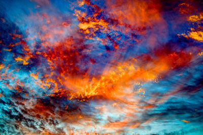 Low angle view of cloudy sky at sunset