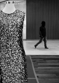 Full length of man standing against wall