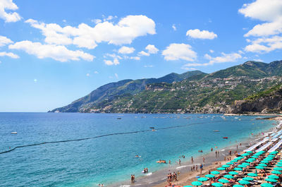 Tourists on idyllic beach in italy