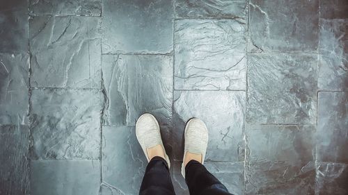 Low section of man standing on floor