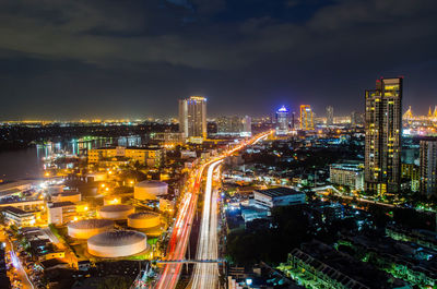 High angle view of illuminated cityscape against sky at night