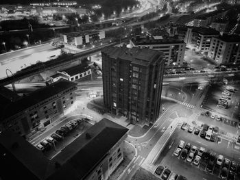 High angle view of city street and buildings at night