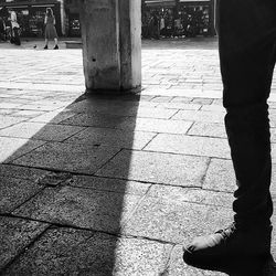 Low section of people on shadow