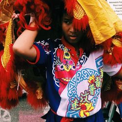 Young man wearing costume on road during celebration